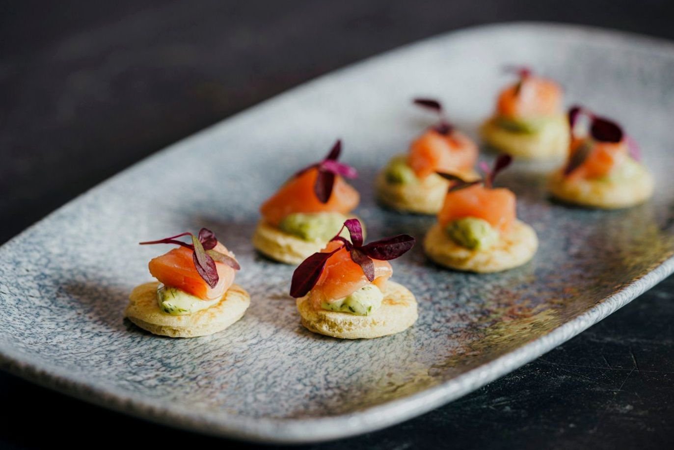 Carefully arranged gourmet canapes showcasing detailed presentation